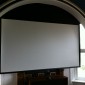 Large 103” screen tucked under arch