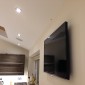 Flat screen TV installed with ceiling speakers